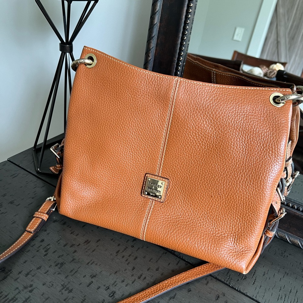 Dooney crossbody purse in a camel color